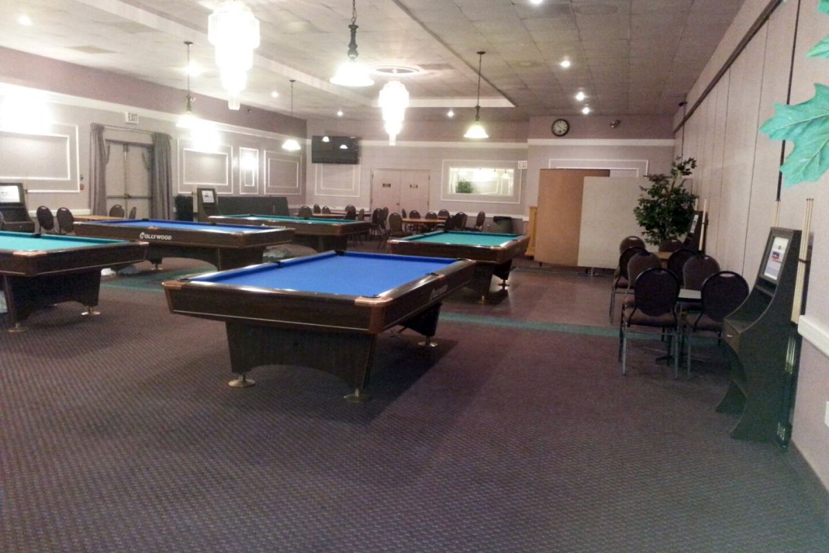 Billiard room with pool tables
